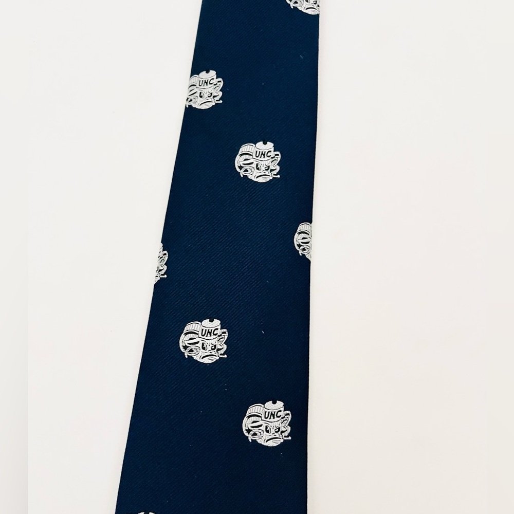 UNC TARHEELS tie by Ram Collection tie. navy blue with white ram's heads